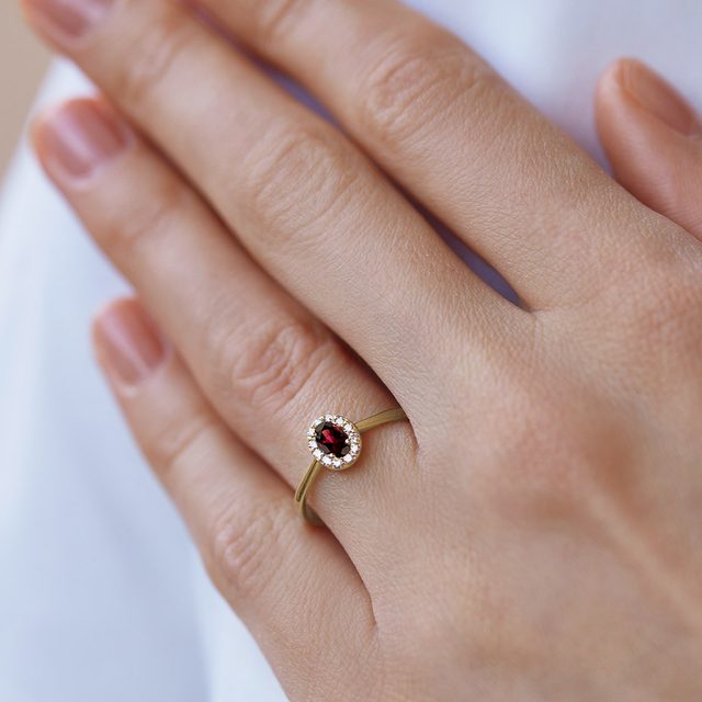 OVAL GARNET AND DIAMOND GOLD HALO RING - GEMSTONE RINGS - 